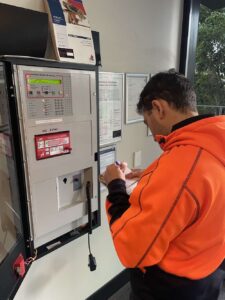 a man writing for a fire safety certificate